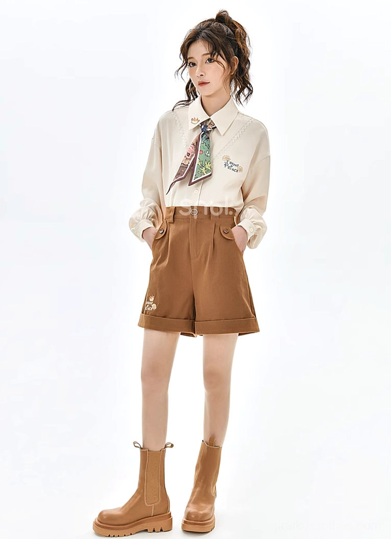 Back view of mori kei outfit showing vest asymmetrical hemline, blouse construction, and embroidered details from rear angle