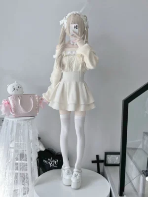 Off-shoulder white knit sweater with detachable straps and soft fur trim on model wearing long white stockings Jirai Kei fashion