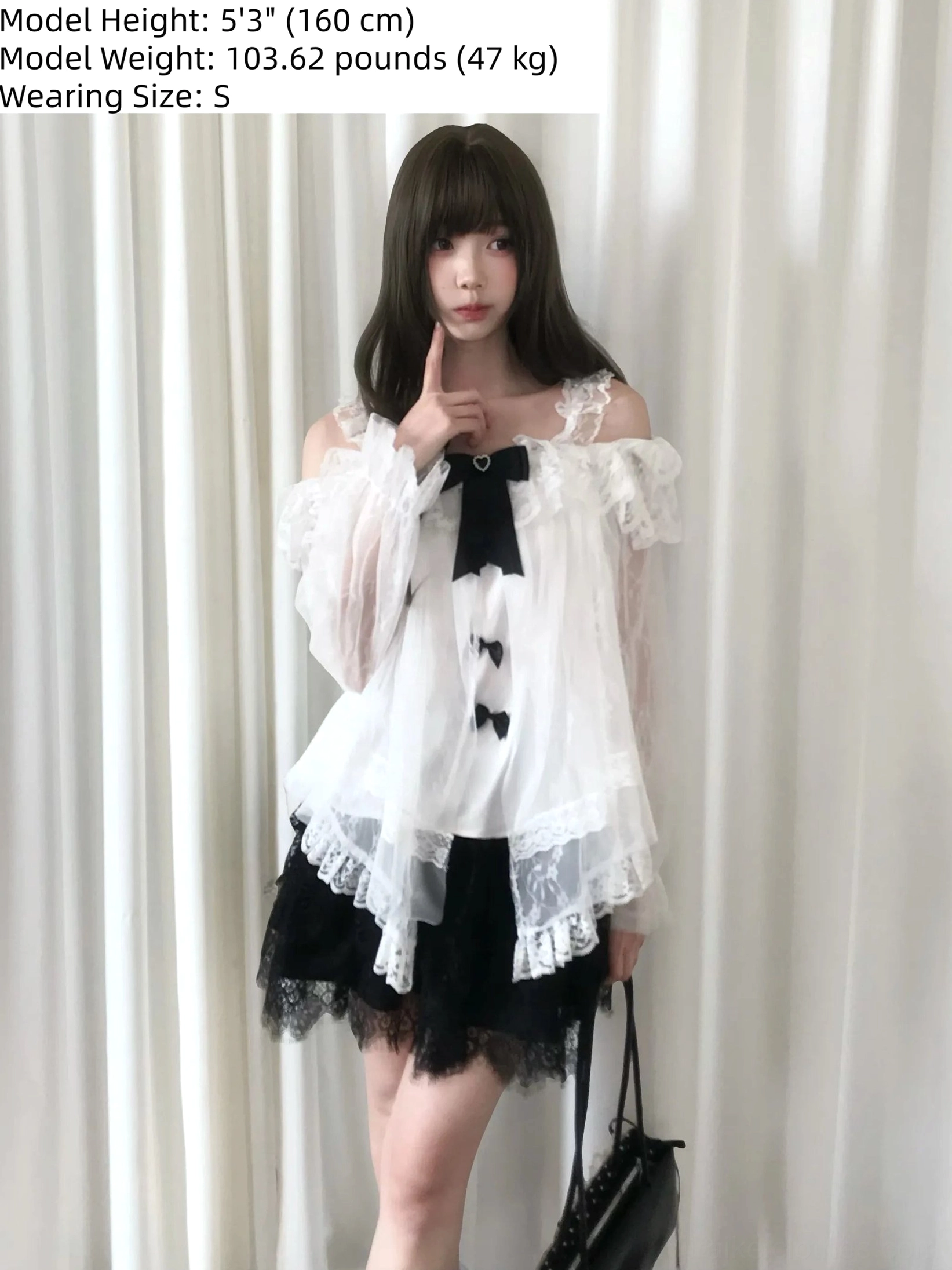 Full-body front shot of off-shoulder lace blouse and tulle skirt ensemble displaying ruffle details, showing model height and weight information for sizing reference
