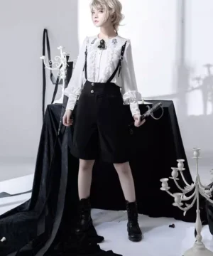 Ouji prince lolita blouse with suspender shorts full front view blonde model gothic studio aesthetic white ruffled lace shirt black shorts