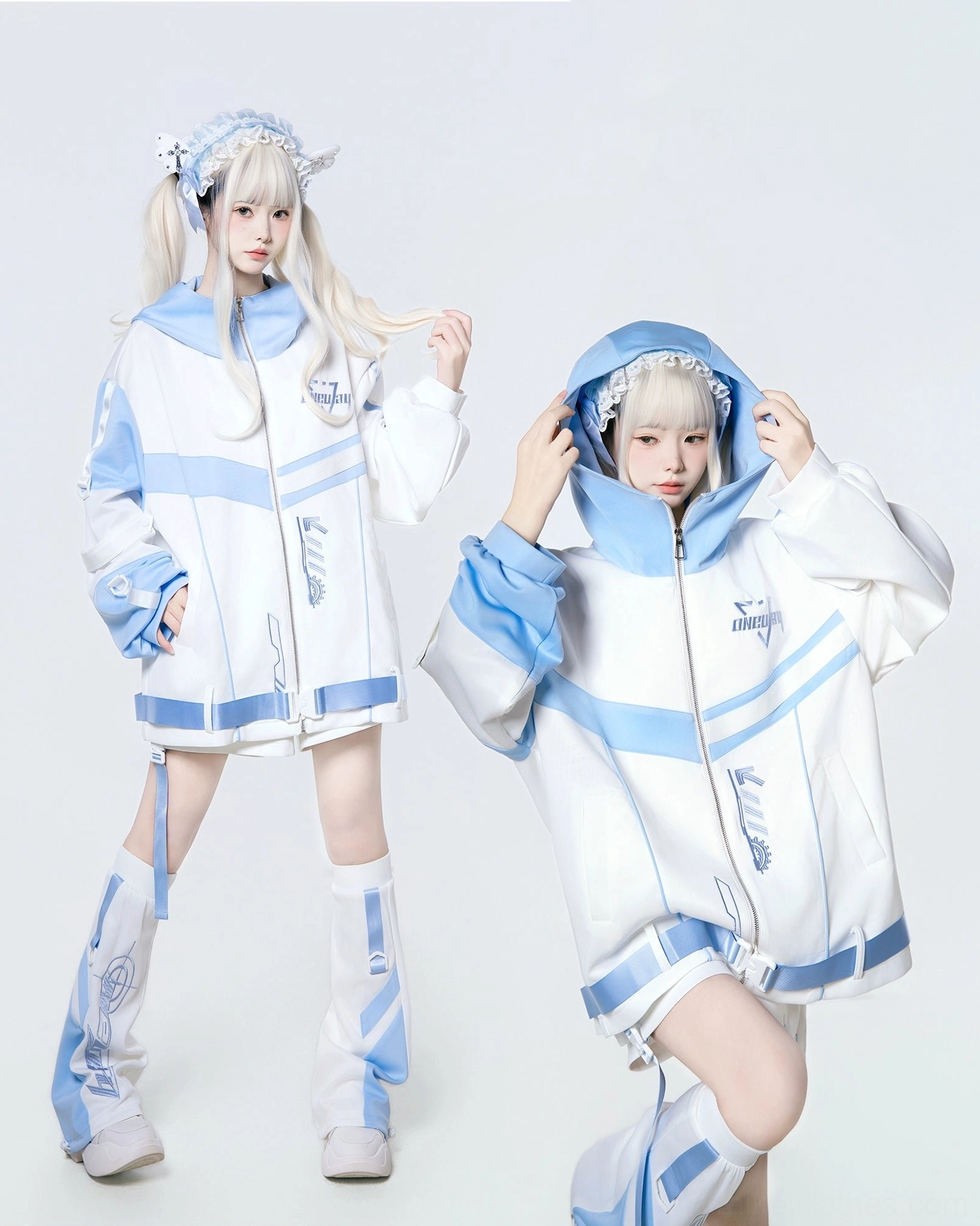 Two identical oversized hooded Jirai Kei jackets in white and light blue - front and three-quarter view angles showing fit and proportions