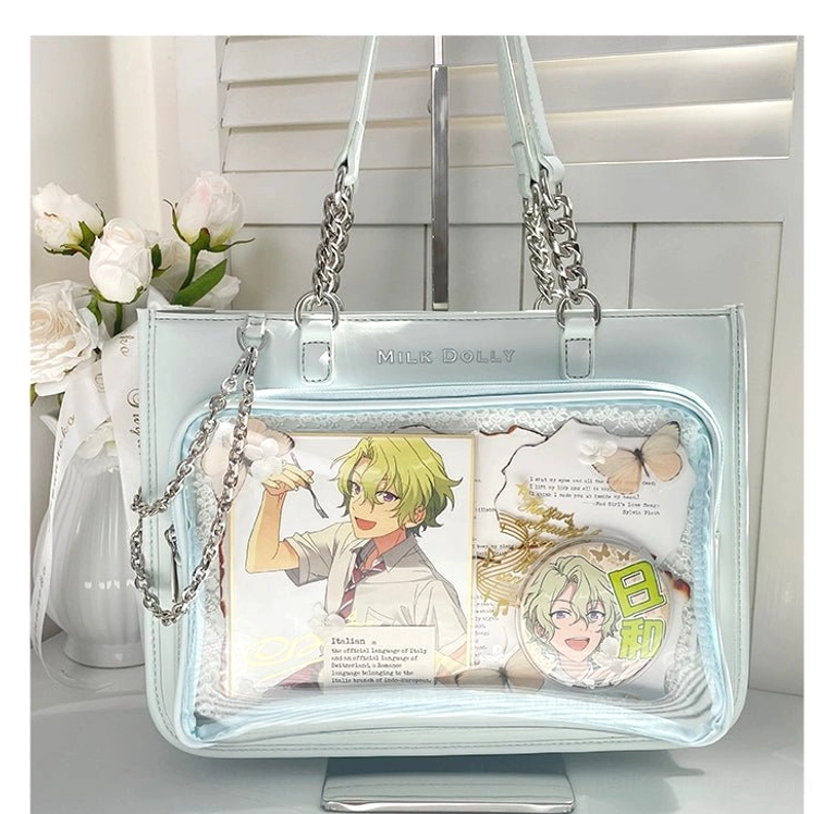 Pale cyan checkered ita tote bag front flat lay with transparent pocket and chain straps on white roses desktop