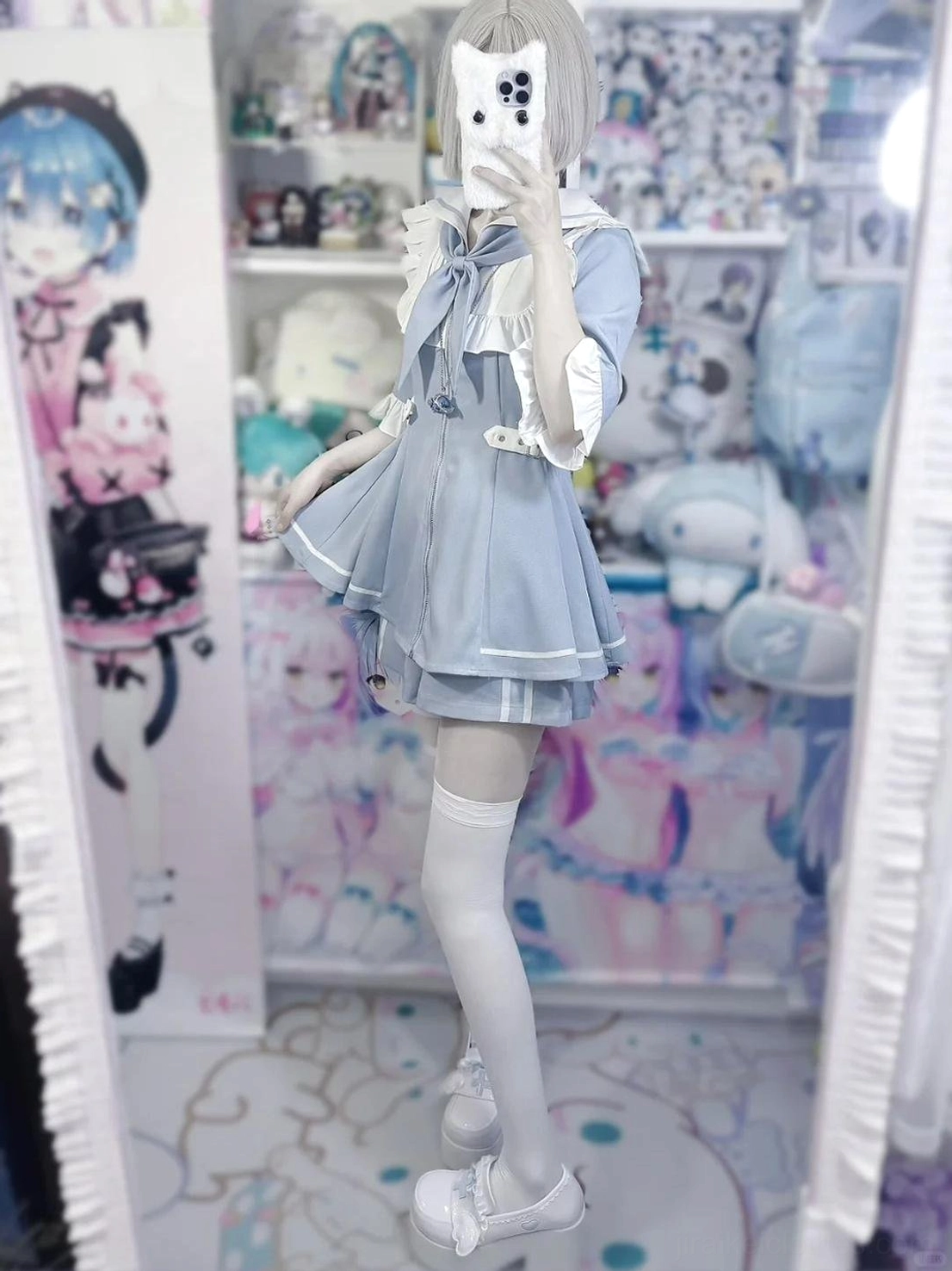 Flat lay product photography of complete pastel blue sailor Jirai Kei dress and shorts set showing full silhouette, convertible sleeves, and coordinated pieces