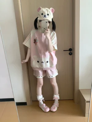 Pastel pink bear ice cream jirai kei zip-up sweatshirt and shorts set worn by model with twin tails in mirror selfie