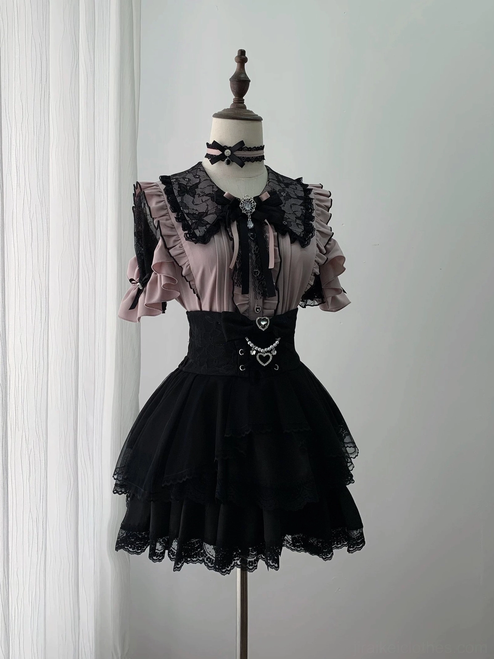 Pink and black Jirai Kei blouse with lace ruffle collar front bow and high-waisted layered lace skirt display