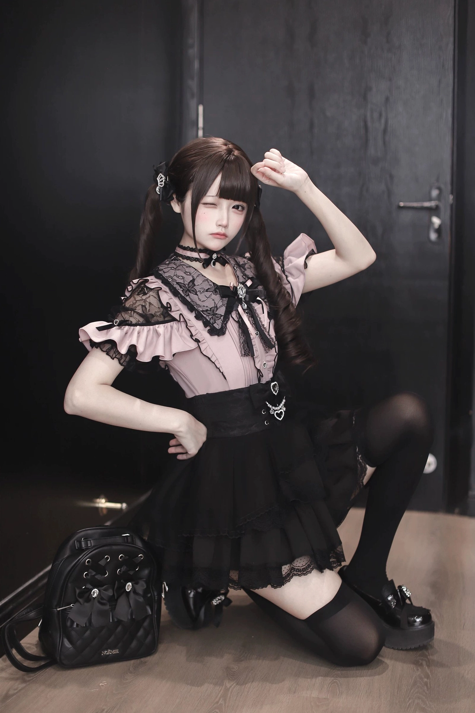Pink and black Jirai Kei blouse styled with rhinestone bow tie choker necklace accessory