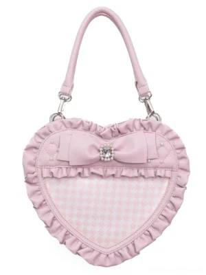 Pink heart-shaped Jirai Kei itabag flat lay front view with ruffled trim, rhinestone bow decoration, and houndstooth pattern display window on white background