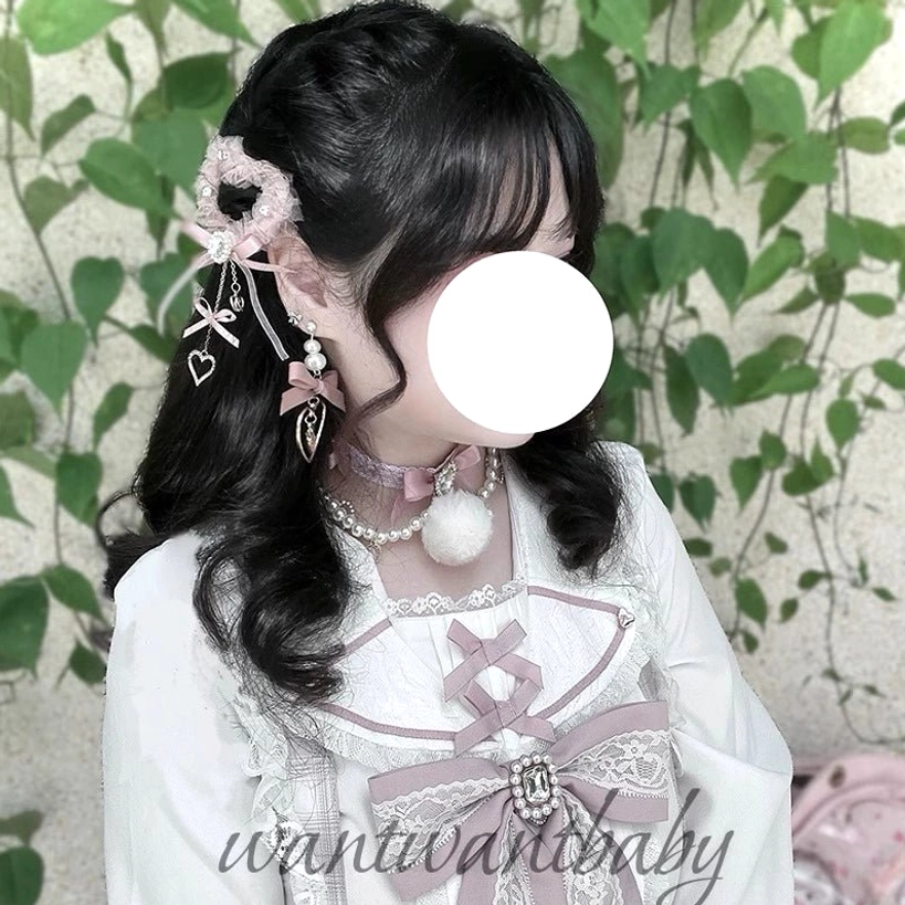 Pink heart-shaped tulle hair clip styled on model with sweet lolita fashion, pinned on side bangs for jirai kei aesthetic