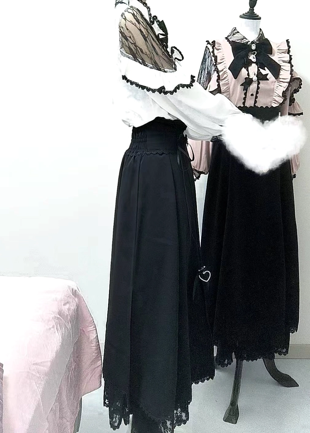 Pink jirai kei blouse with lace trim and bow detail showing romantic cute landmine girl aesthetic design