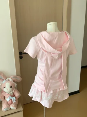 Back view of pink kawaii bunny-ear hoodie jacket showing long ears and relaxed fit design for Jirai Kei fashion style