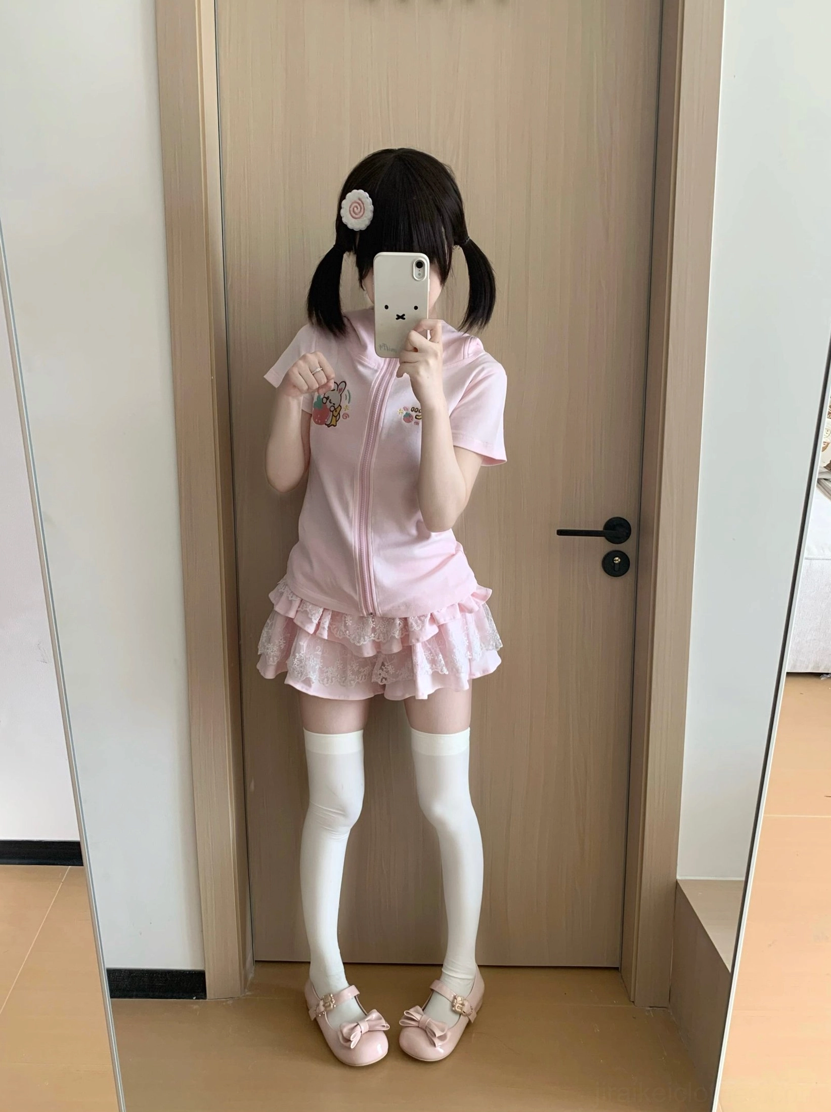 Full-body mirror selfie wearing pink Jirai Kei bunny-ear hoodie with thigh-high white socks and kawaii aesthetic styling