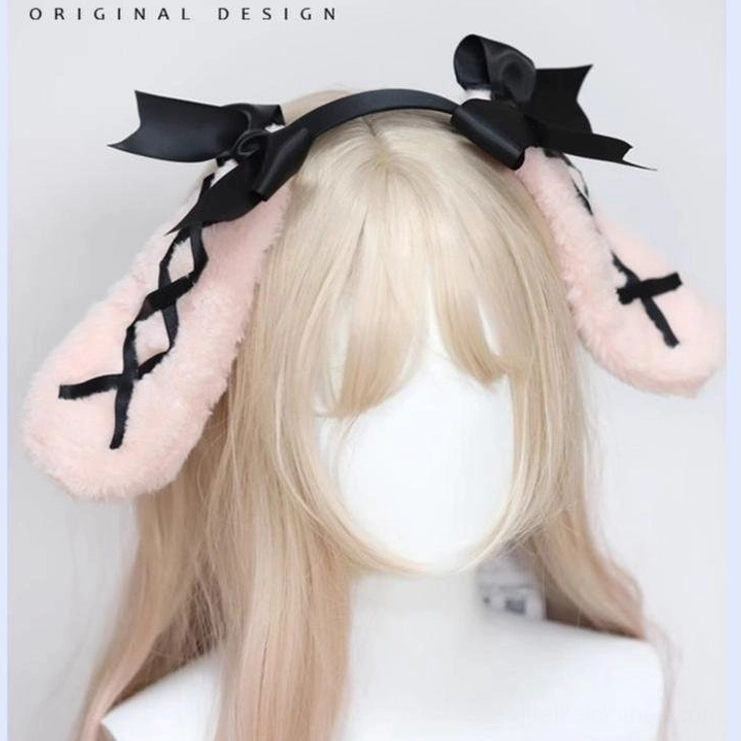 Pink rabbit ear hairband front flat lay view on blank mannequin head display with fluffy pink ears black ribbon and black satin bows