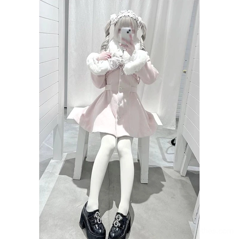 Ryousangata pink Jirai Kei winter coat seated three-quarter selfie view indoor studio with curtains rhinestone buttons fitted flared skirt hands adjusting removable collar trim