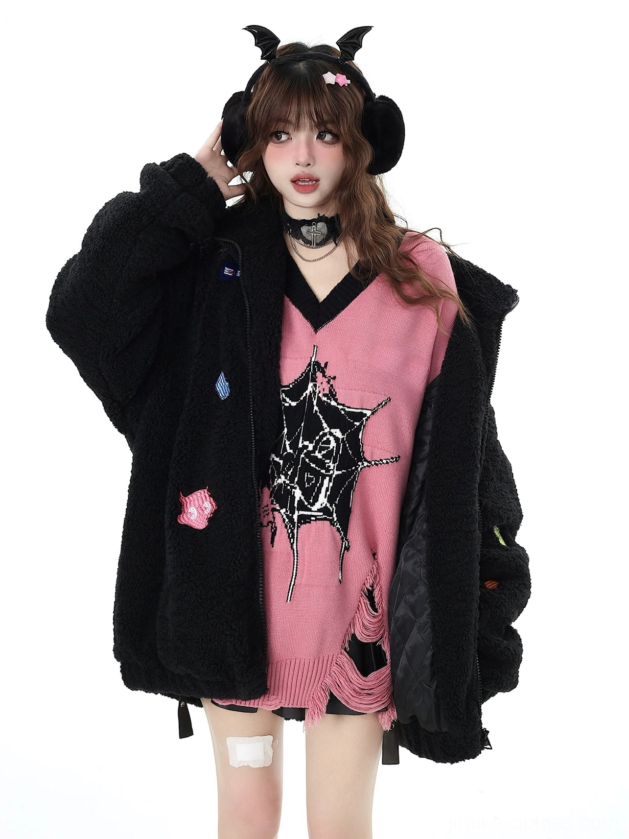 Pink Jirai Kei V-neck knit sweater with star and spider web print detail close-up showing design precision