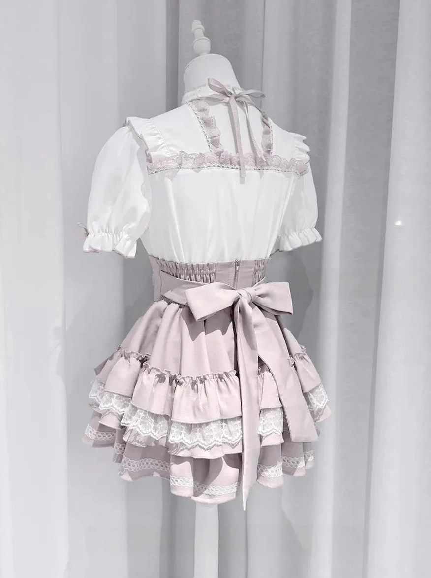 Pink Jirai Kei tiered ruffle skirt with large back bow decoration shown from rear view on dress form