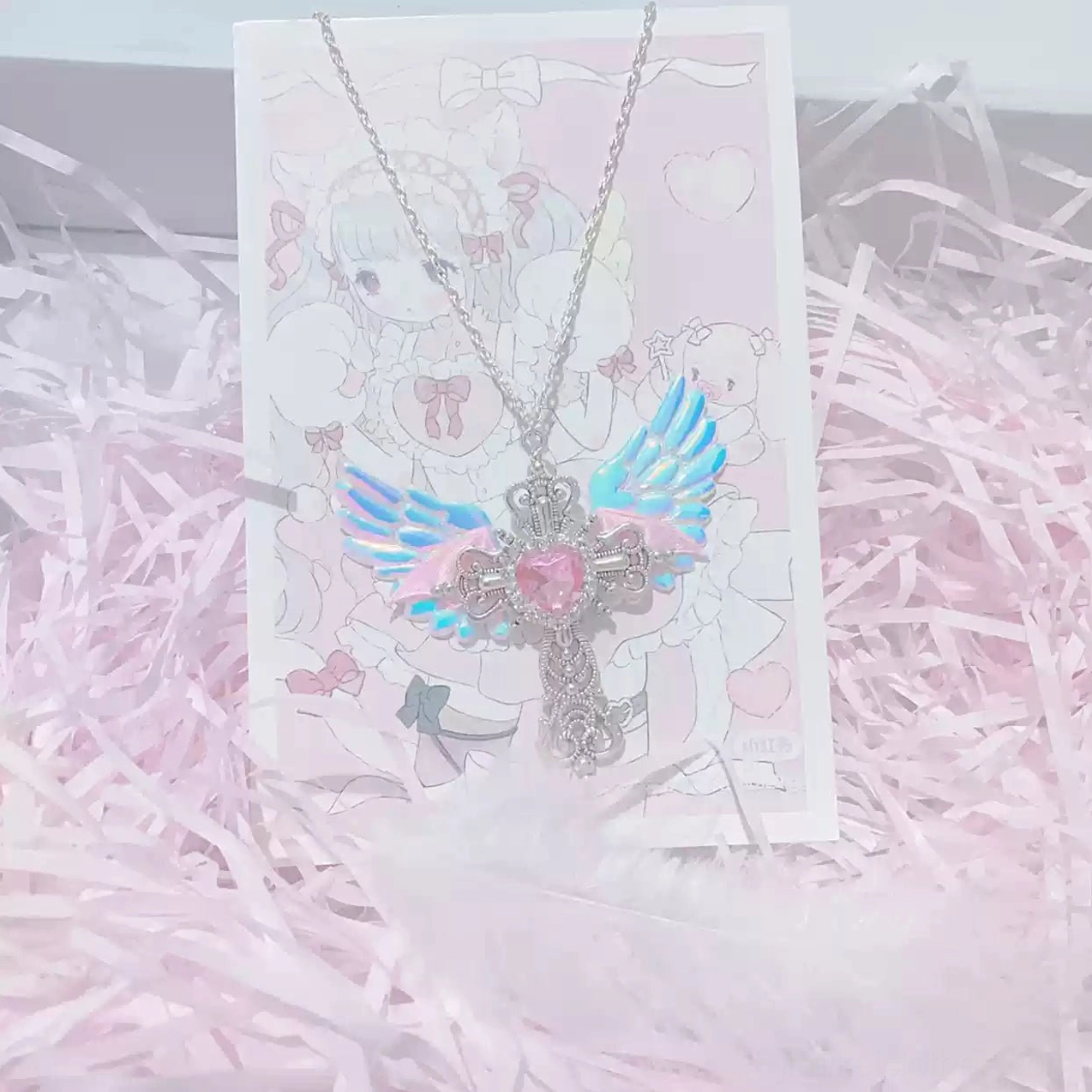 Pink Jirai Kei winged cross necklace with pink heart rhinestone and silver filigree cross with pink fabric wings alternative jewelry