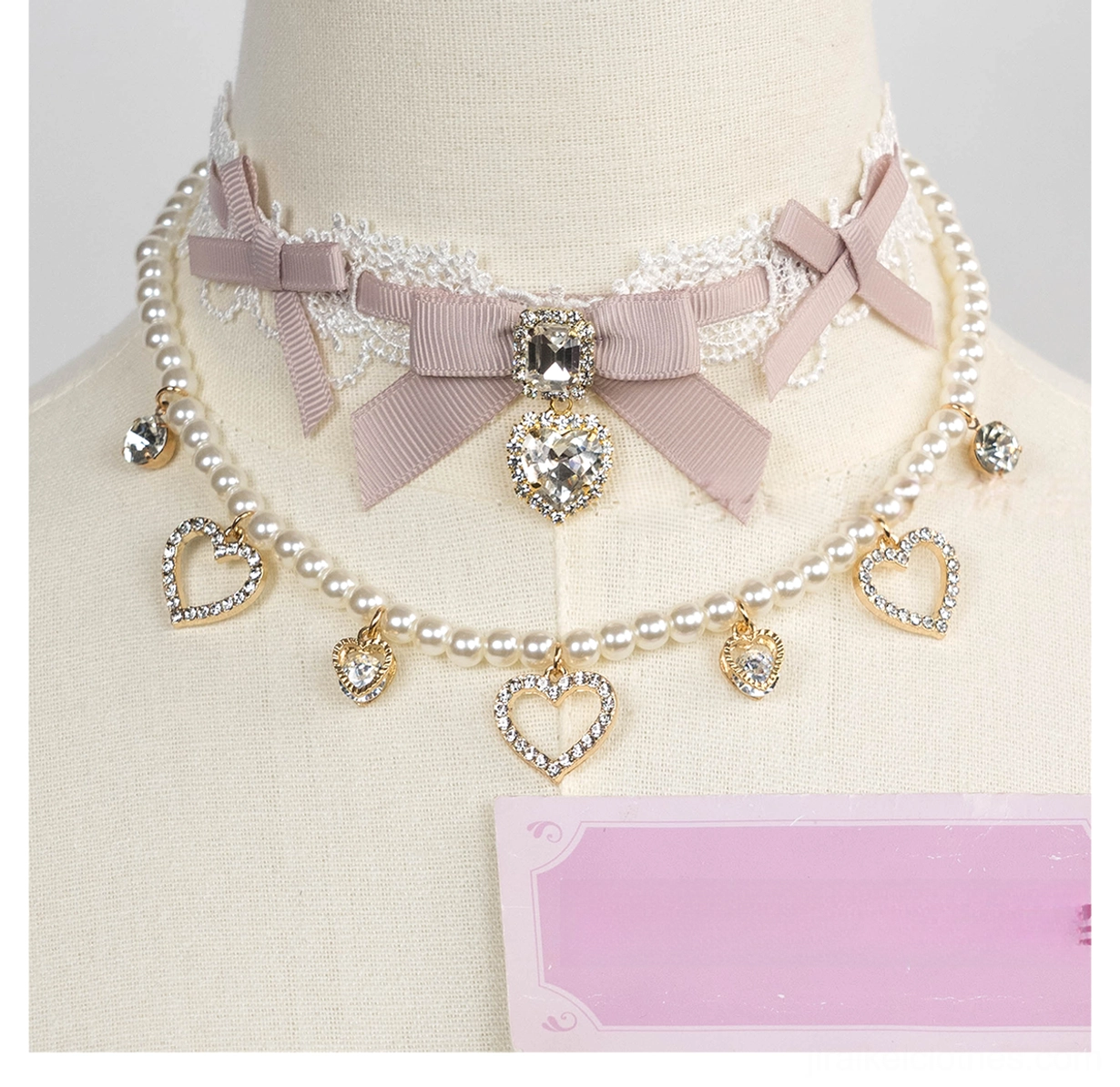 Pink lace bow jirai kei choker with white lace trim heart rhinestone pendant front view