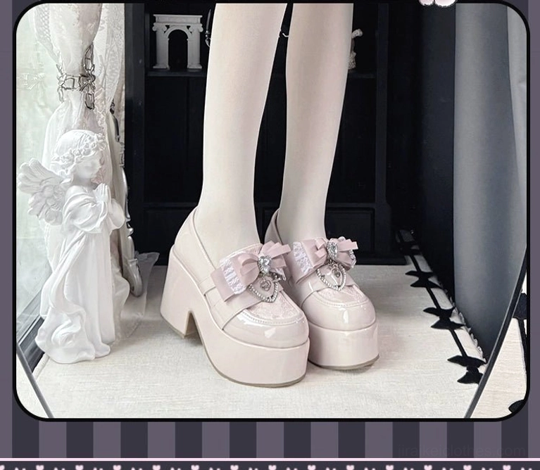 Pastel pink Ryousangata Jirai Kei platform loafers featuring glossy patent leather finish and crystal bow embellishment, side profile view in vintage dollhouse setting