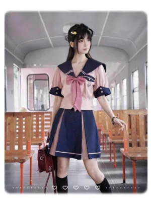 Short-sleeve pink sailor JK uniform with navy sailor collar embroidery, worn with brown leather bag and black knee-high socks in vintage train cabin