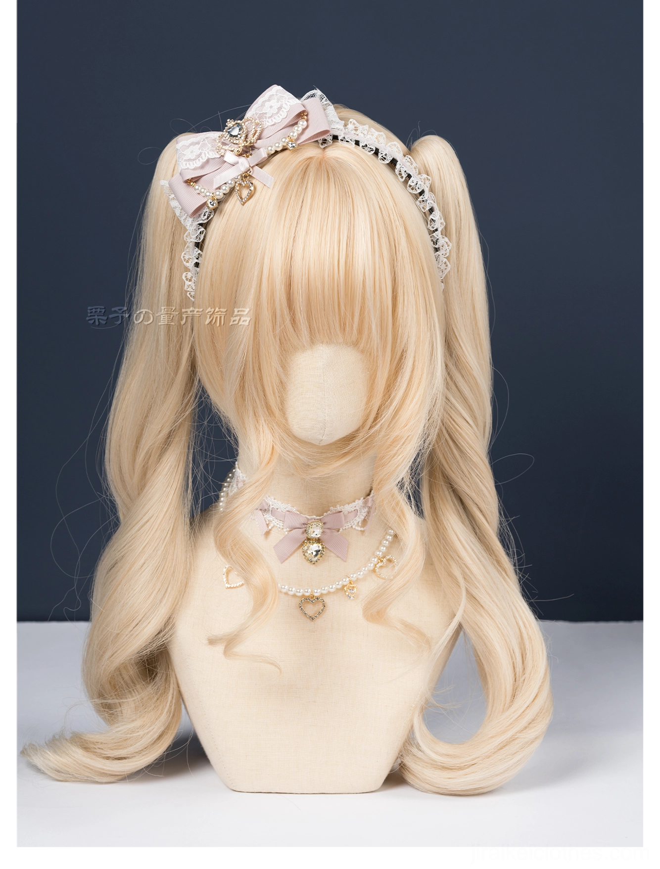 Pink and white ryousangata bow headband three-quarter view mannequin head rhinestone center lace trim dark backdrop jirai kei