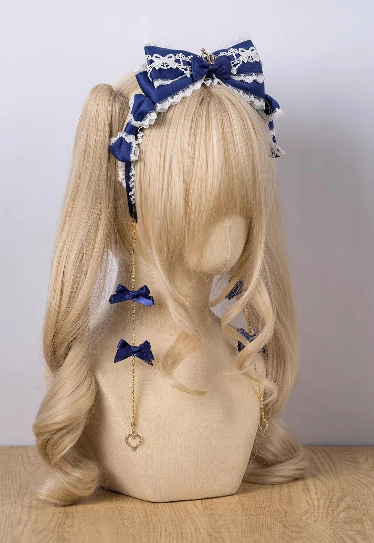 Pink white two-tone satin bow headband with lace overlay and rhinestone crown flat display view