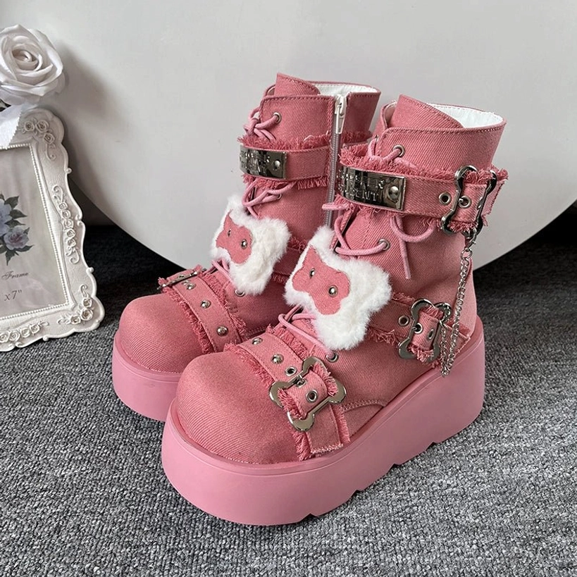 Platform Martin boots worn at alternative music venue, concert setting demonstrating subculture festival fashion wear