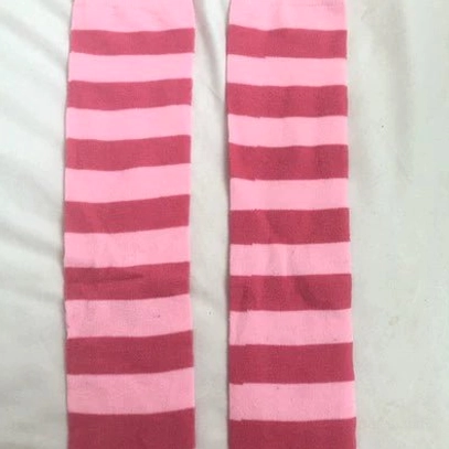 Powder pink striped over-the-knee socks close-up texture detail, premium cotton spandex blend quality material