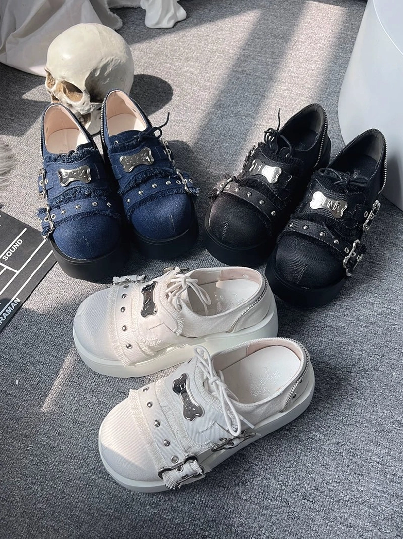 Punk platform loafer jirai kei shoes flat lay skull prop white denim blue matte black thick chunky sole bone metal details