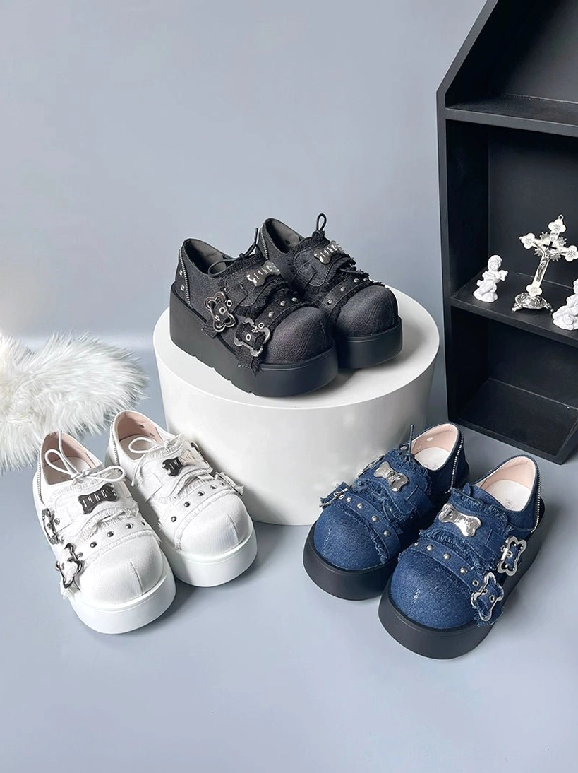 Punk platform shoes jirai kei neutral studio flat lay round display pedestal cross ornaments matte black white denim blue