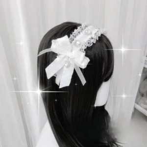 Pure white jirai kei lace headband with ruffled trim and satin bow featuring rhinestone embellishments rear view