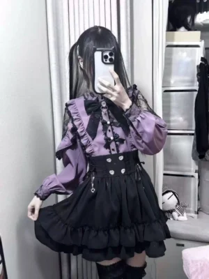 Purple Jirai Kei blouse with lace trim and black detachable bow worn by model in bedroom mirror selfie front view shot