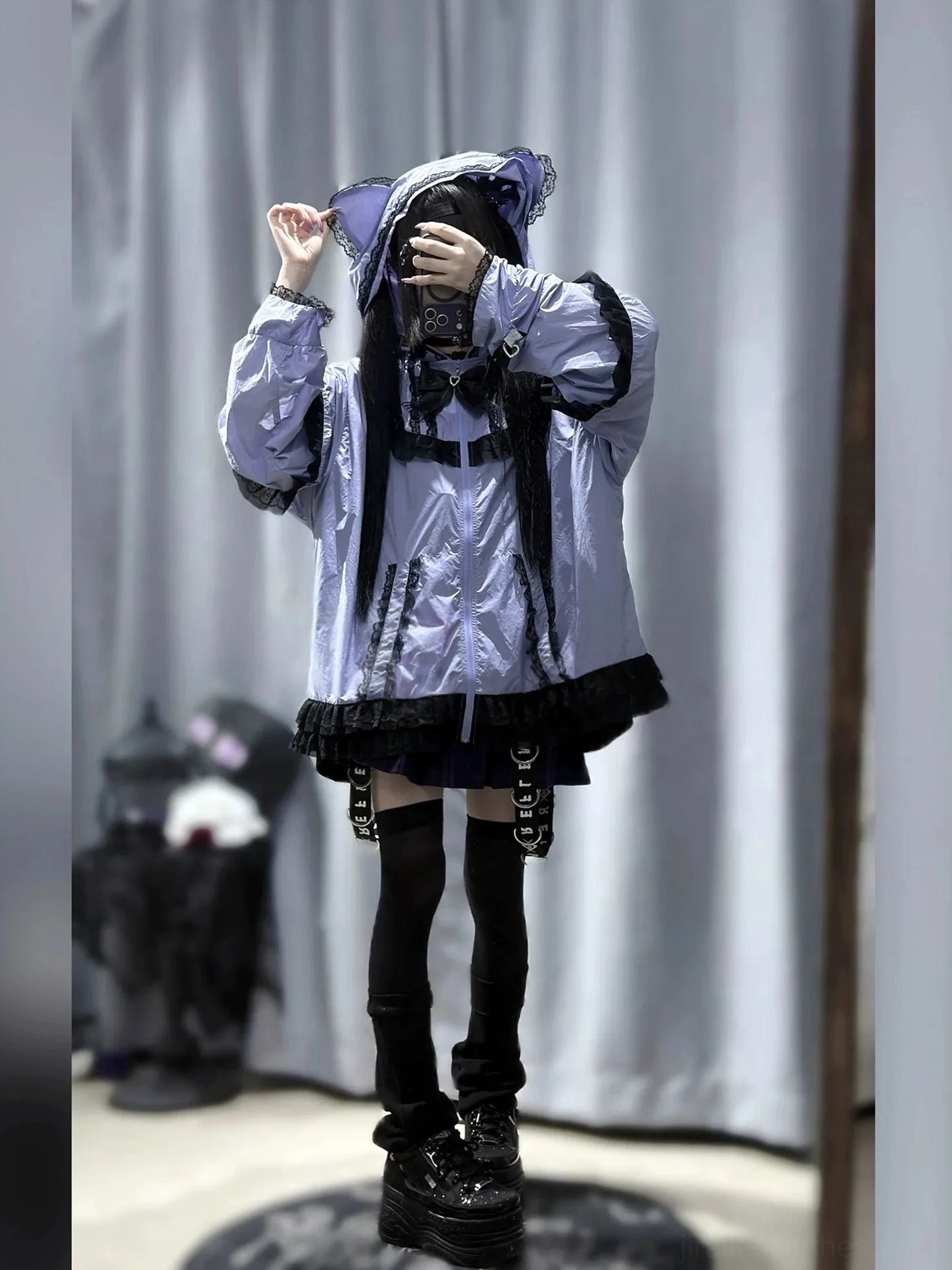 Purple cat-ear sun jacket back view on gothic model with platform boots and black ruffled hem