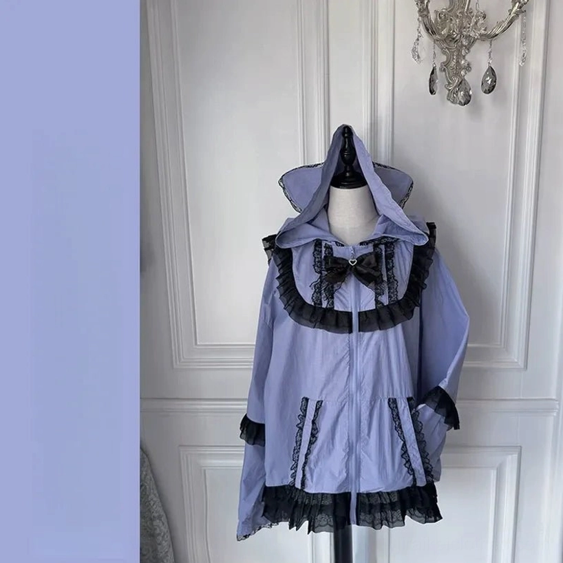 Purple cat-ear sun jacket on mannequin front view with lace trims bow collar and vintage room setting