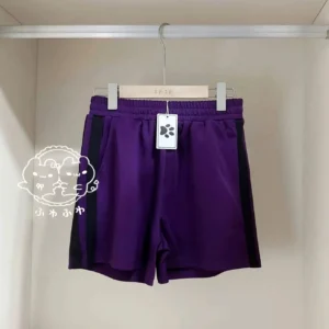 dark purple jirai kei shorts full elastic waist hanging view black stripe detail