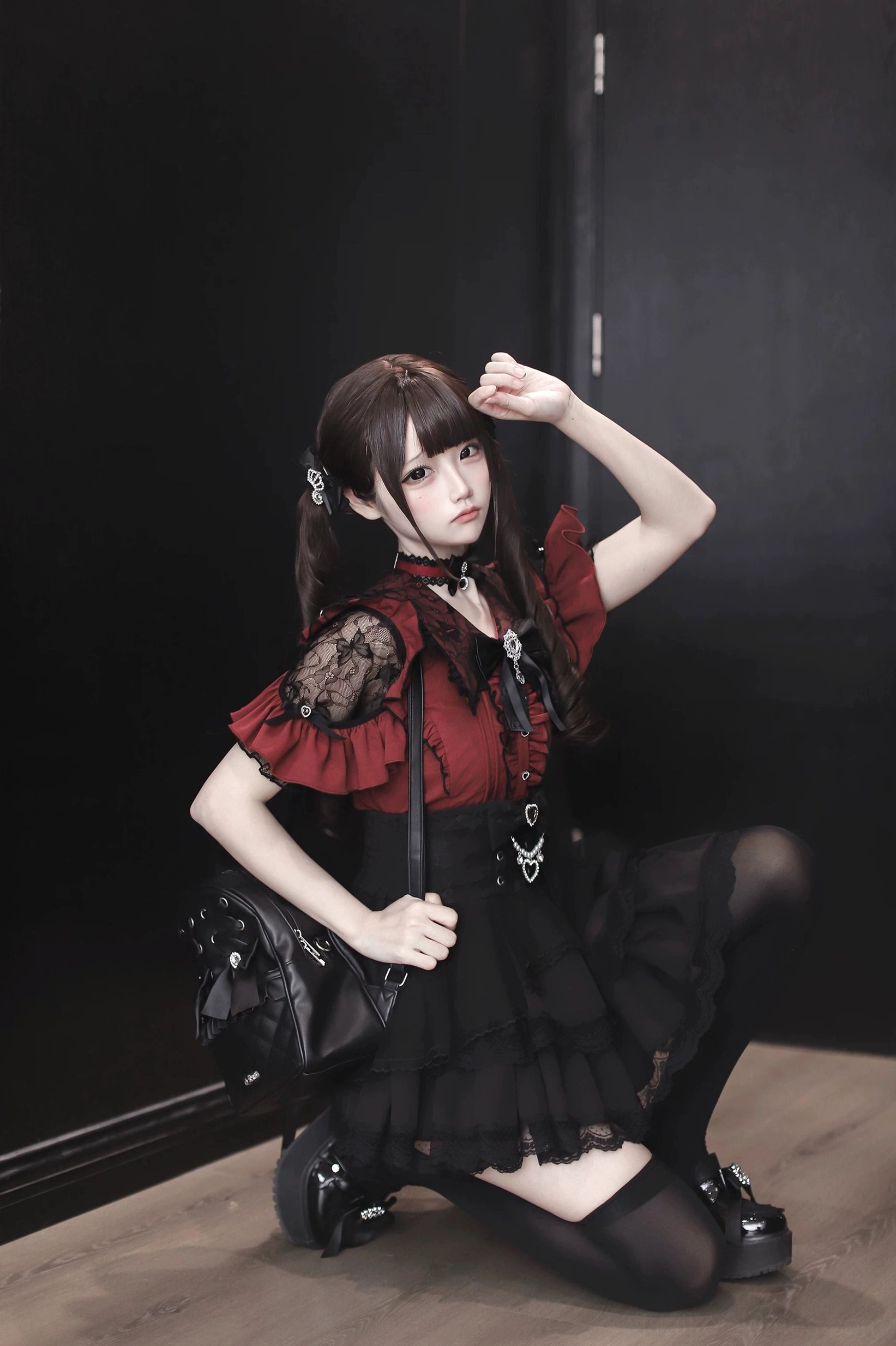 Red and black Jirai Kei blouse back view with pintuck details and lace trim