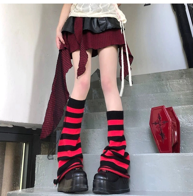 Red and black horizontal striped Y2K Jirai Kei leg warmers slouchy fit front view female model layered skirt outfit staircase