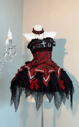 Red and black tartan gothic lolita dress set displayed on mannequin in studio setting showing strapless bustier top with buckle straps and irregular hemline with bows