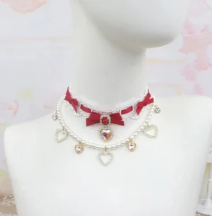 Red bow heart rhinestone choker necklace with double-layered pearl chains and lace collar detail, Jirai Kei aesthetic jewelry front view on mannequin