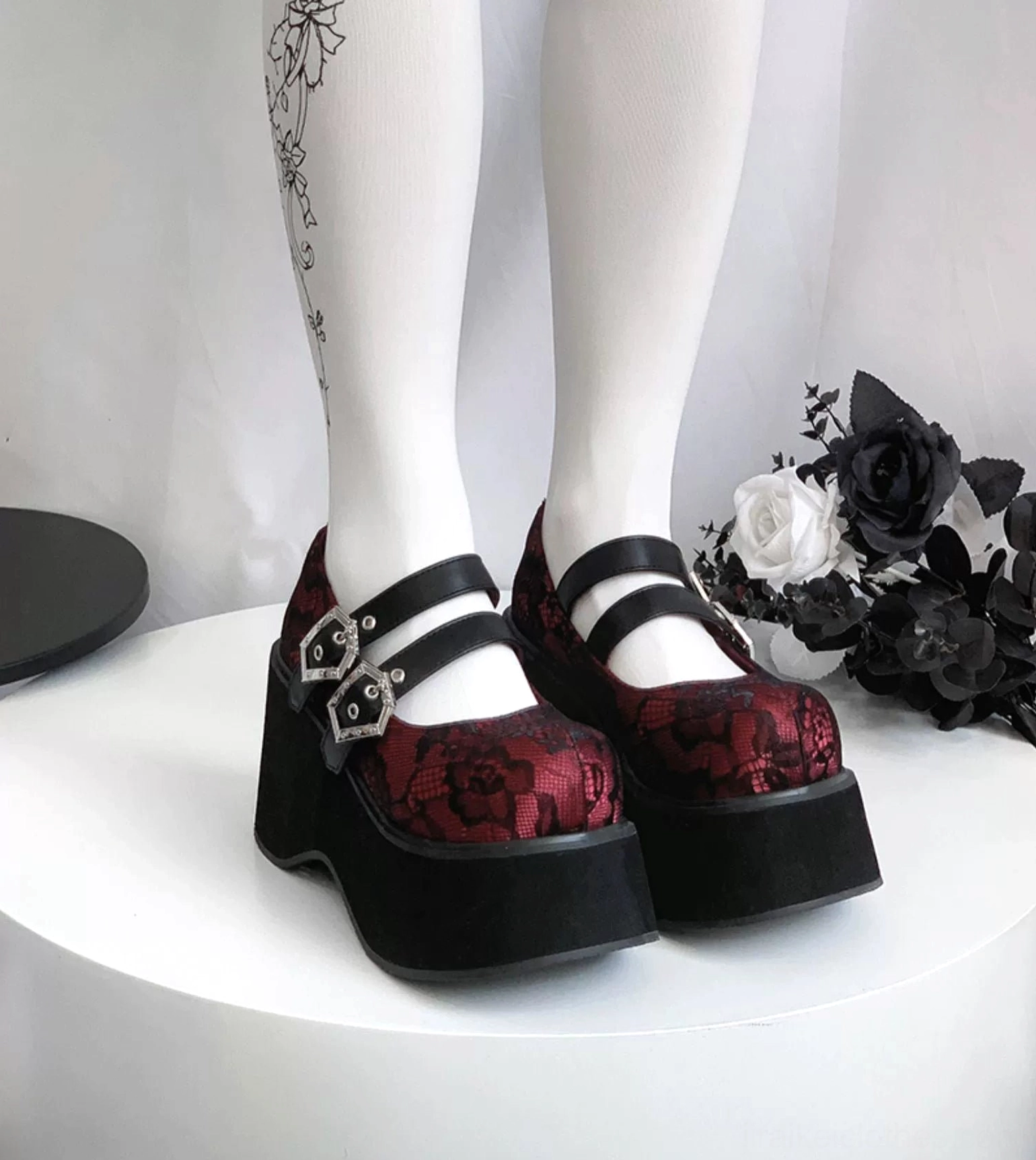 Gothic platform Mary Jane shoes red lace upper with dual silver hexagonal buckles showing vibrant color and decorative hardware detail
