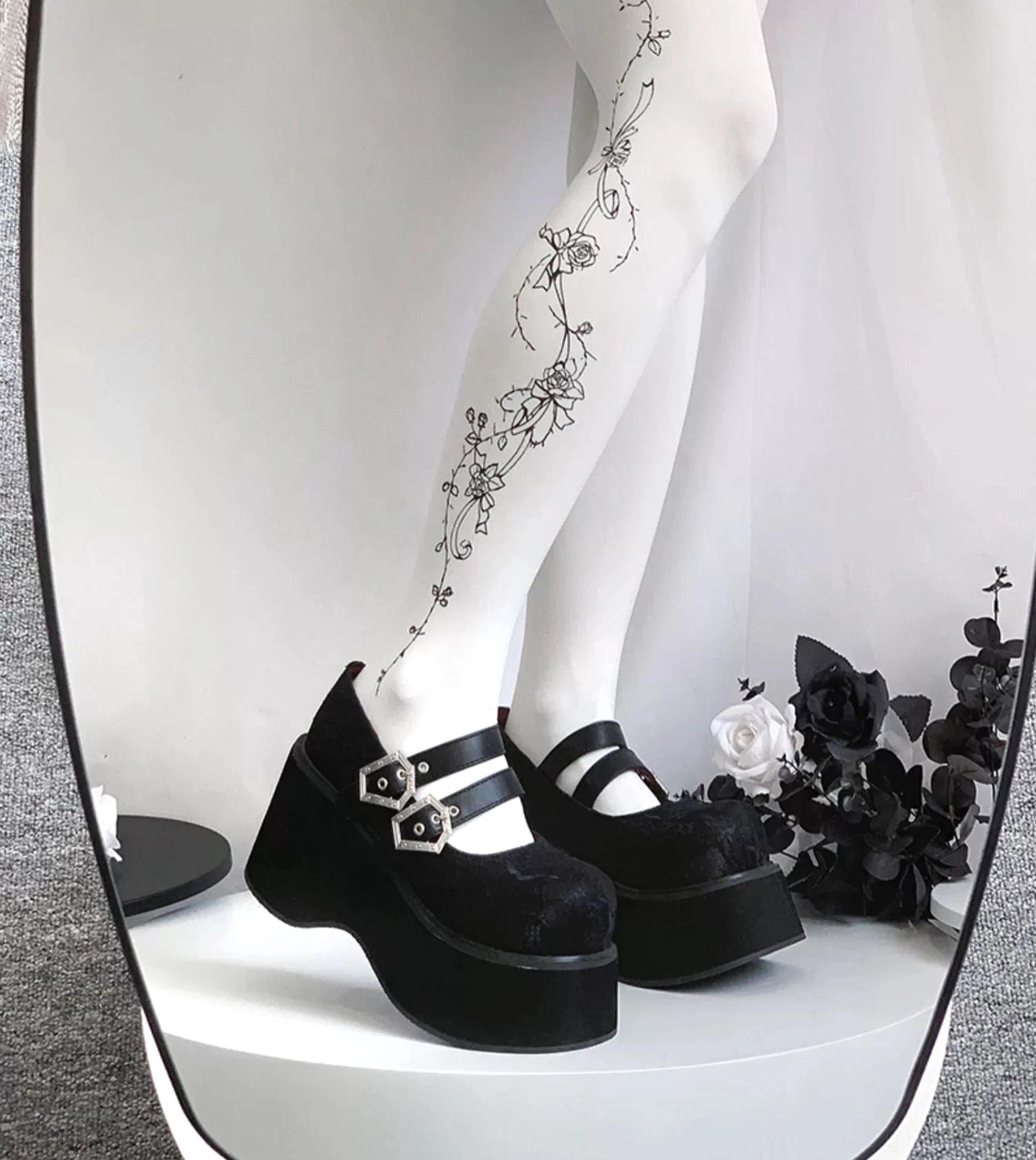 Lace red Mary Jane platform shoes three-quarter angle showing bold color thick platform sole dual buckes and round toe silhouette
