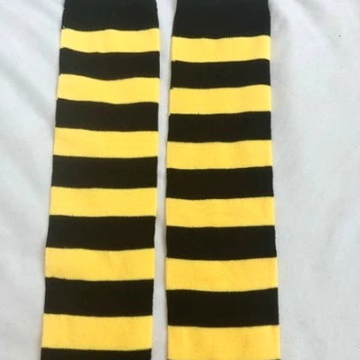 Red and white striped over-the-knee socks flat lay display, classic punk energy horizontal stripe design, white background