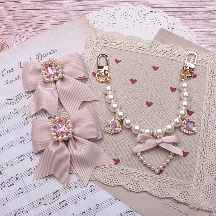 Ryousangata bag charm detail view showing faux pearl rhinestone heart pendant clip attachment mechanism