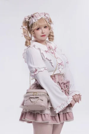 Nude pink Ryousangata bucket bag side profile with detachable pearl chain strap lolita model styling