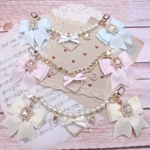Ryousangata Jirai Kei bag charm collection featuring multiple color styles blue pink beige rhinestone bows metal and pearl chains heart pendants top view