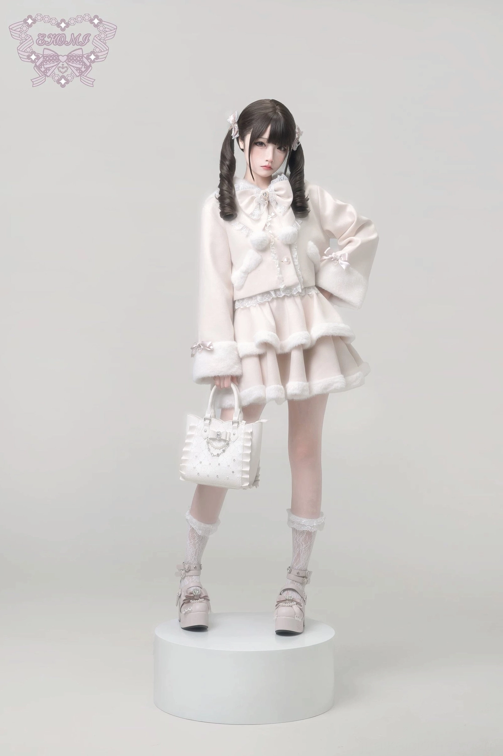 Ryousangata Jirai Kei coordinate set with tailored bell sleeves and fur cuff details, tiered ruffle skirt with lace underlays, front standing view with handbag coordination