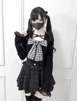 Ryousangata Jirai Kei knit top with black houndstooth chest bow full-body front view on model with twin tails