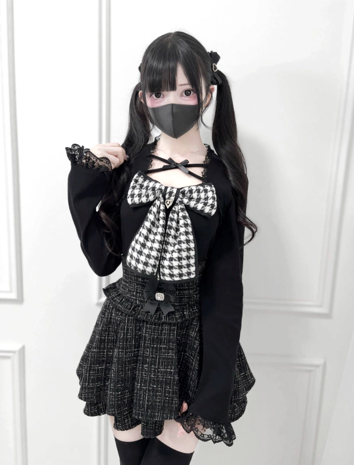Ryousangata Jirai Kei knit top with black houndstooth chest bow full-body front view on model with twin tails