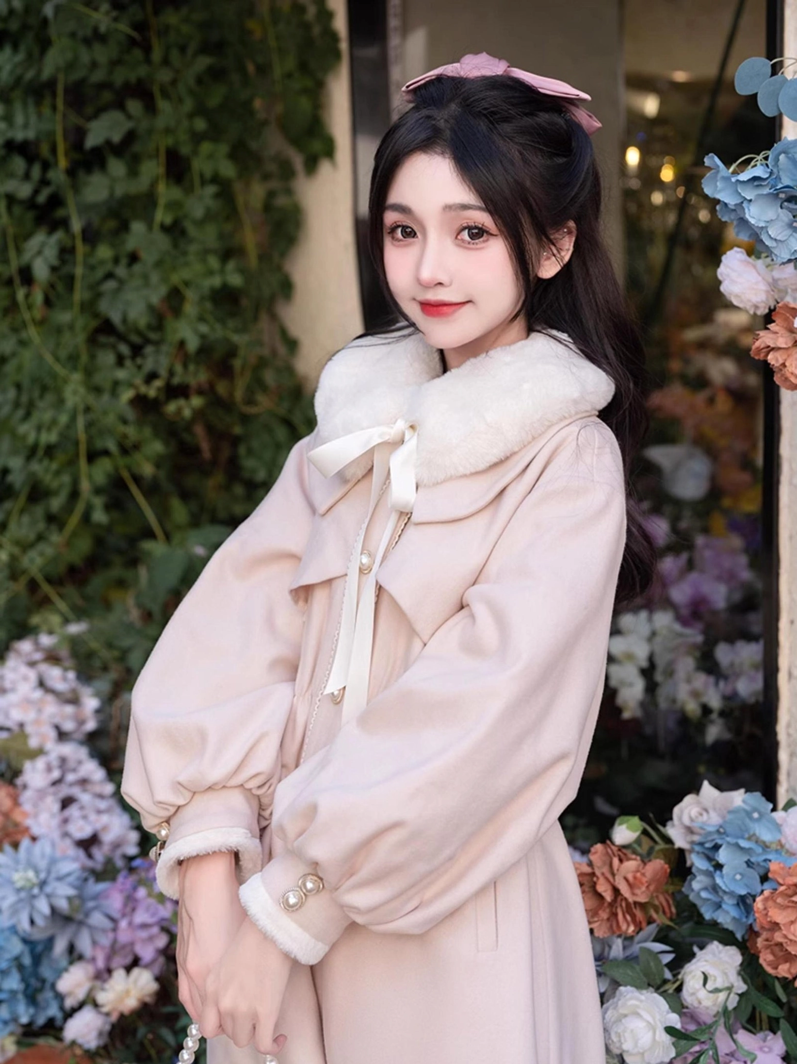 Ryousangata Jirai Kei winter coat close-up upper body shot - girl with pink hair bow wearing coat featuring faux fur collar, front ribbon tie, and buttoned cuffs details
