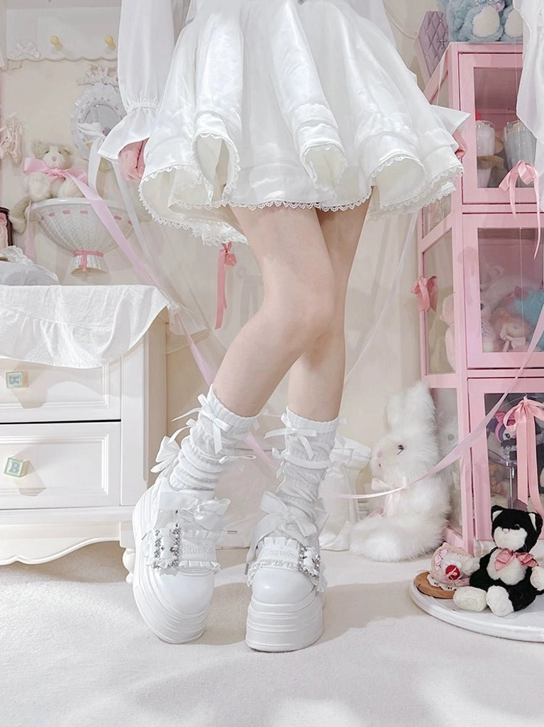 Ryousangata platform shoes ankle detail view showing lace side panels and heel bow on worn feet
