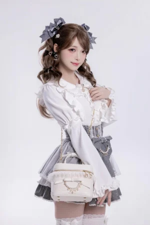 White lace Ryousangata bucket bag with bow handle front three-quarter view Jirai Kei lolita fashion styling